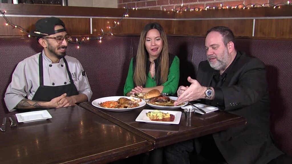 A man and a woman eating at a restaurant