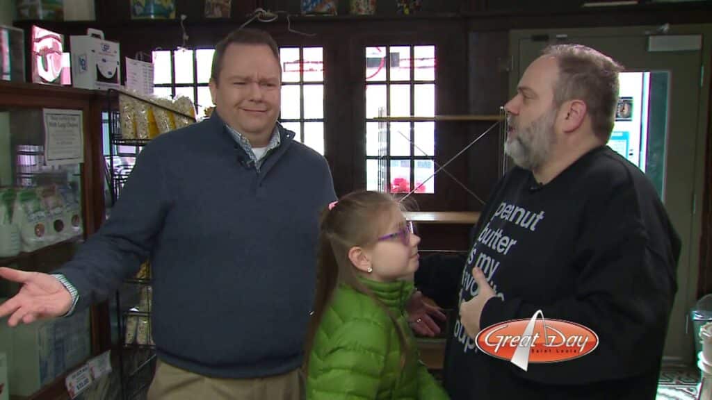 Two men standing beside a little girl