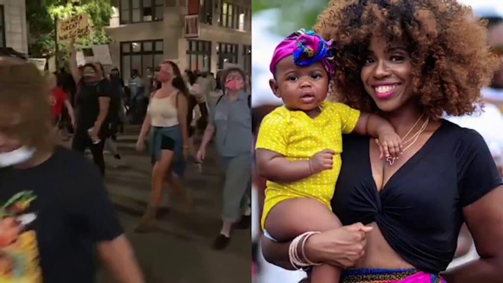 black woman holding baby