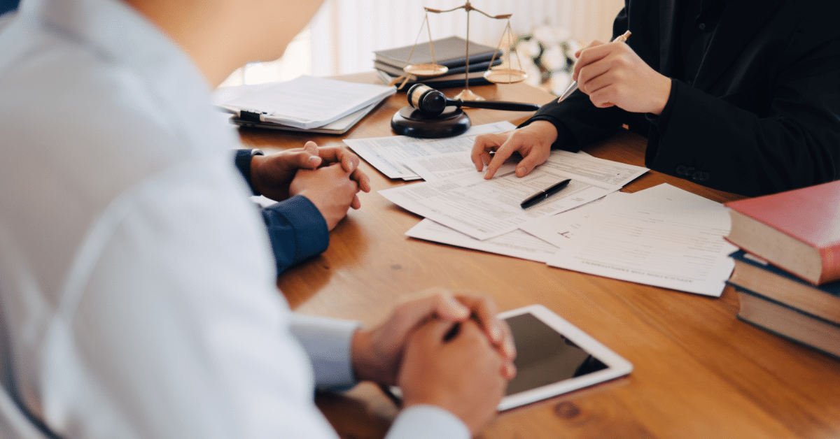 A lawyer and two client having a conversation