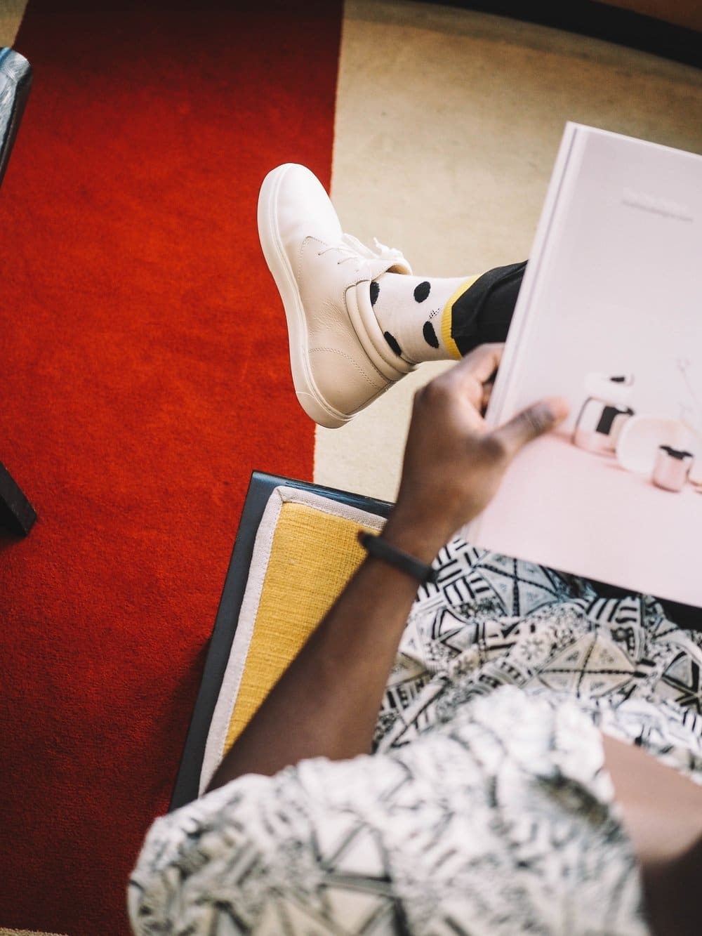 black woman sitting reading a book