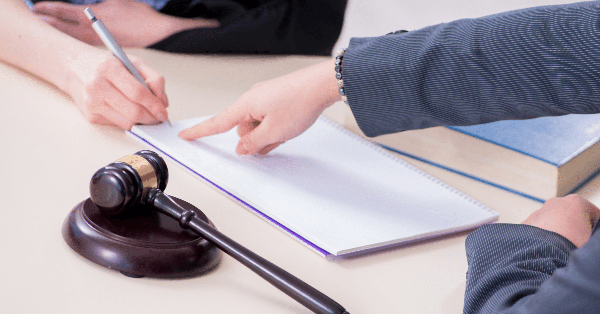 A woman involved in a car accident meeting with her lawyer