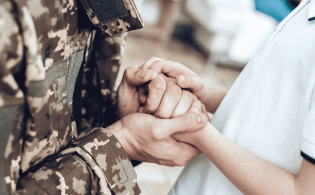 military couple holding hands