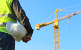 an engineer holding an helmet