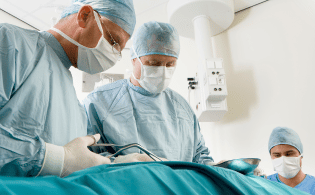 Doctors undertaking surgery