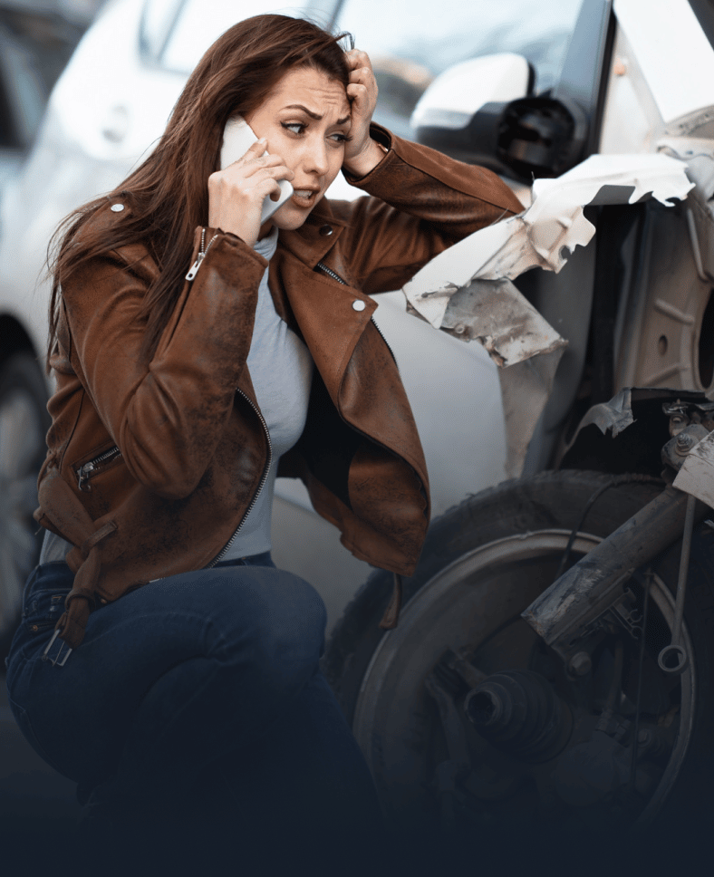 white woman on phone after motorcycle accident
