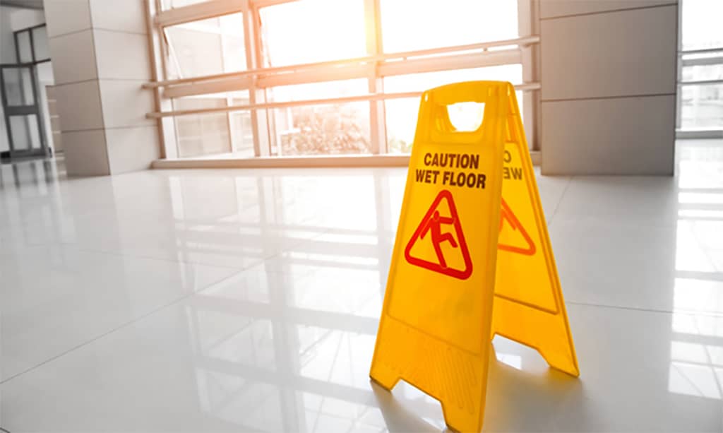 slip and fall sign on white floor