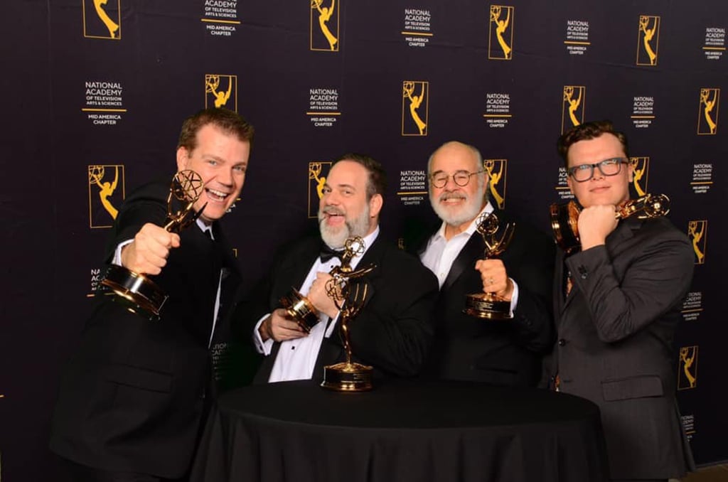 brown and crouppen team holding emmys