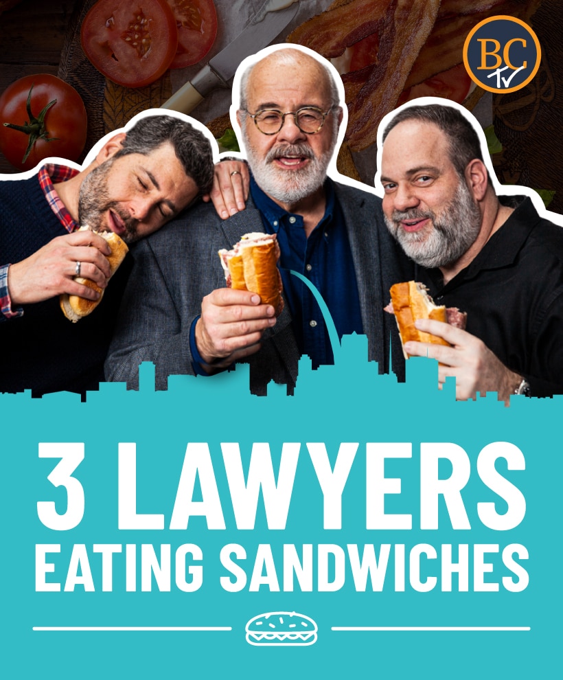 Three lawyers eating sandwiches