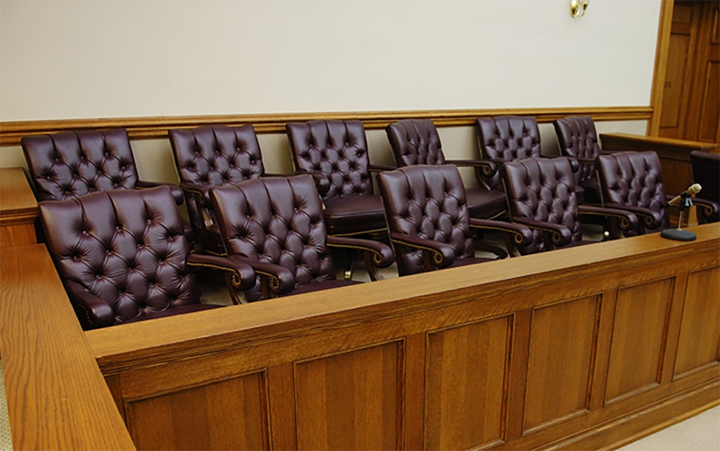 leather chairs in the jury section of a courtroom