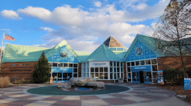 front of a blue building