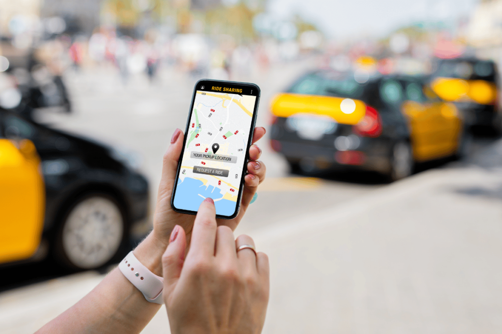 woman holding a phone and ordering a uber