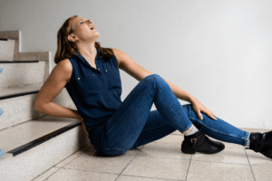 Woman sleeps and fall holding her knee