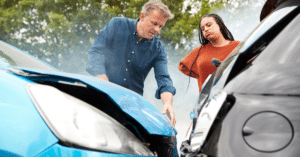 man and woman talk after car accident