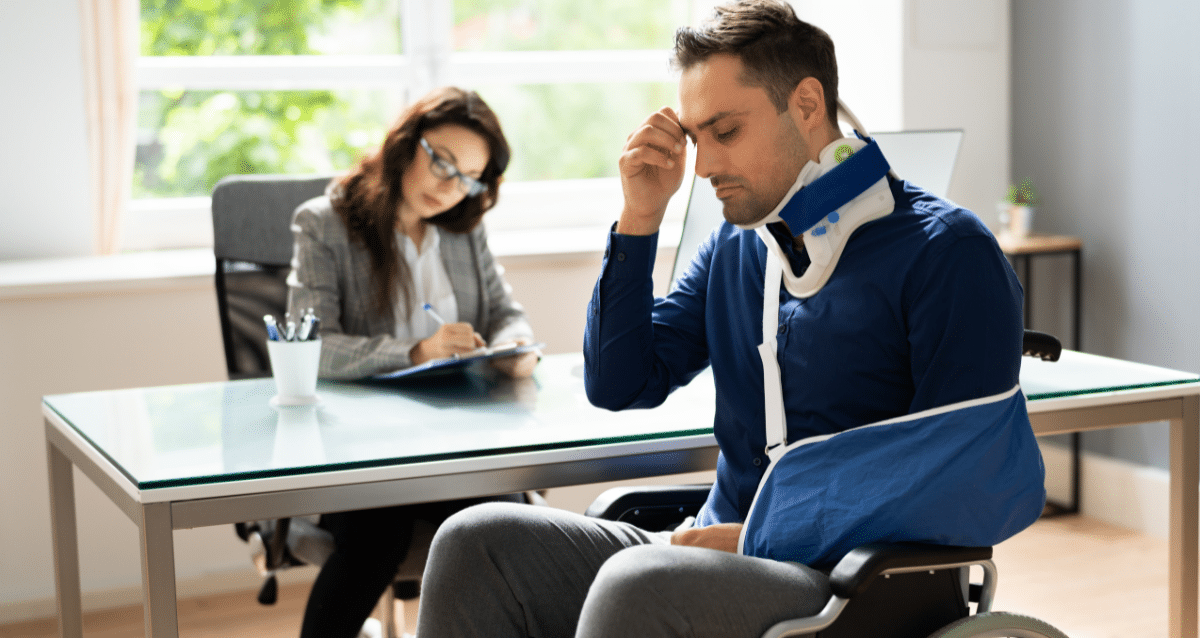 man in wheelchair looking defeated