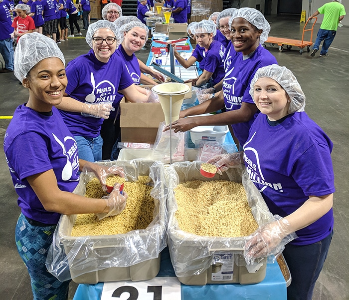 volunteers helping distribute food at a food bank