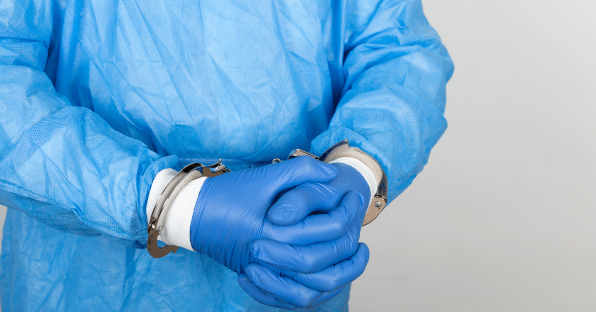 an handcuffed medical practitioner