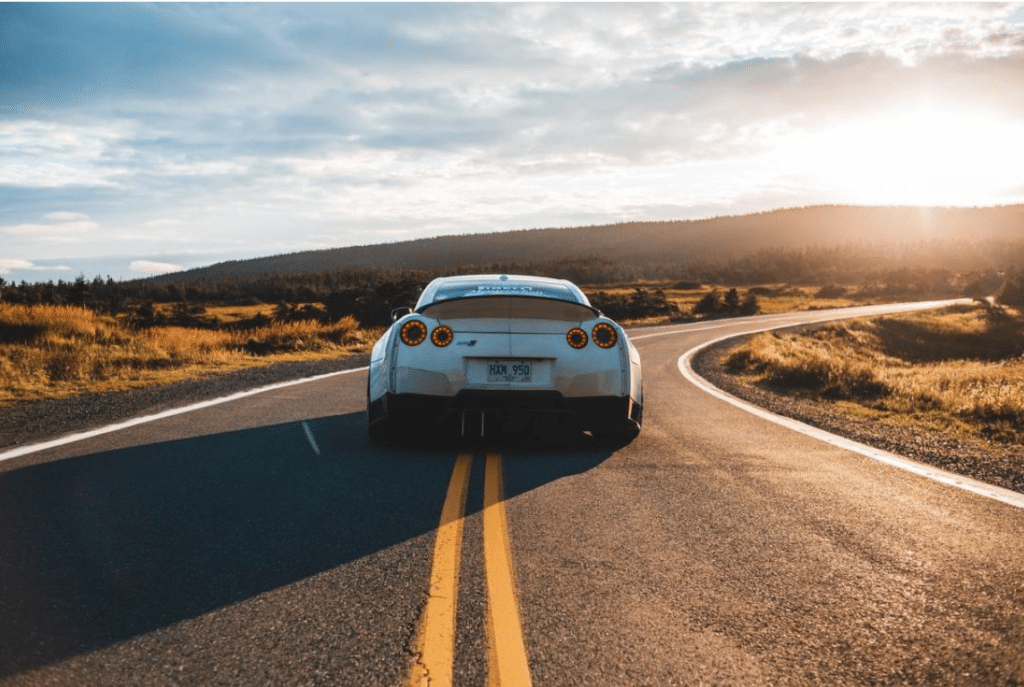 silver sports car on a open road