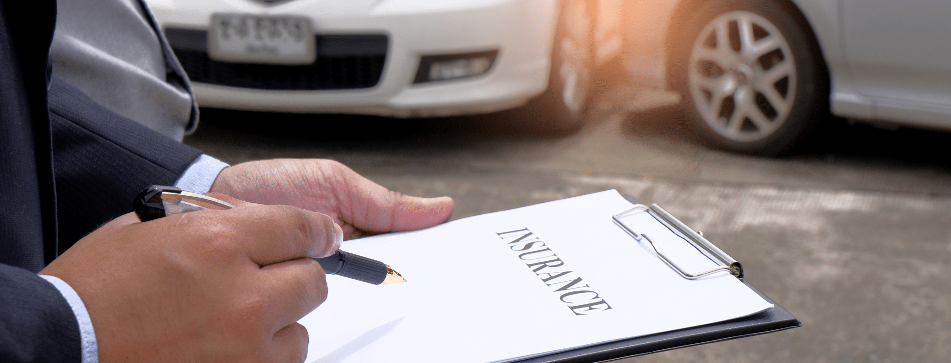 person holding a clipboard of insurance documents - dealing with allstate insurance adjusters