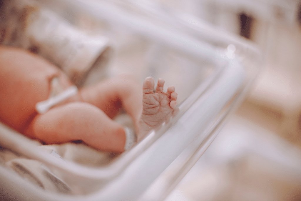 Newborn lying on a hospital bed